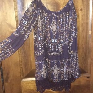 Colorful, patterned blouse.